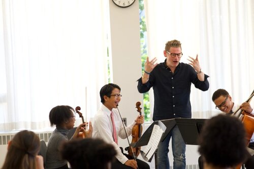 cellist Karlos Rodriguez with masterclass students